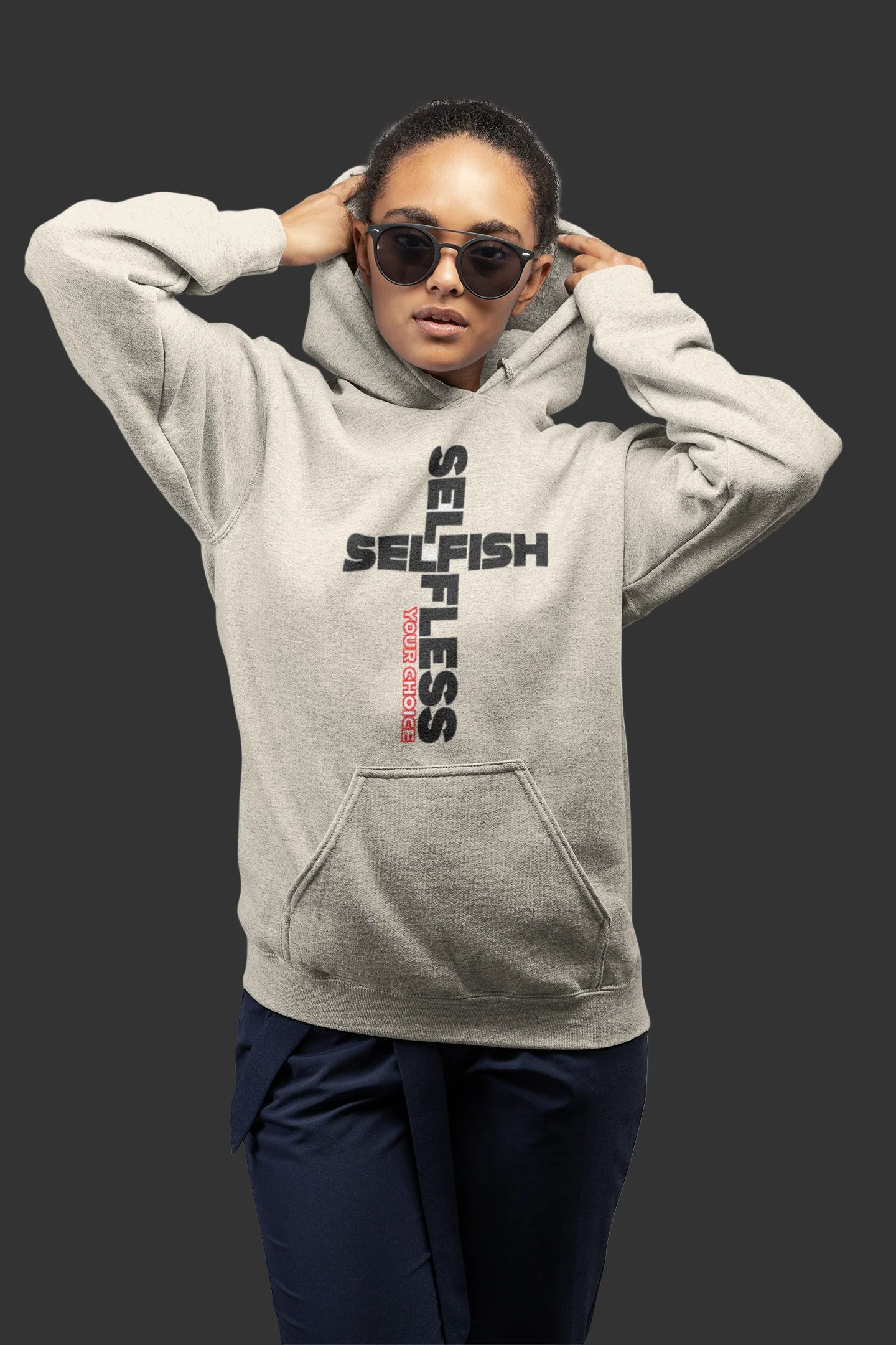 Woman wearing gray SSYC unisex embroidered logo hoodie with sunglasses on dark background